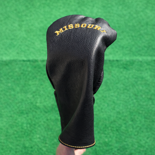 Black golf club head cover with 'Missouri' text on a green background