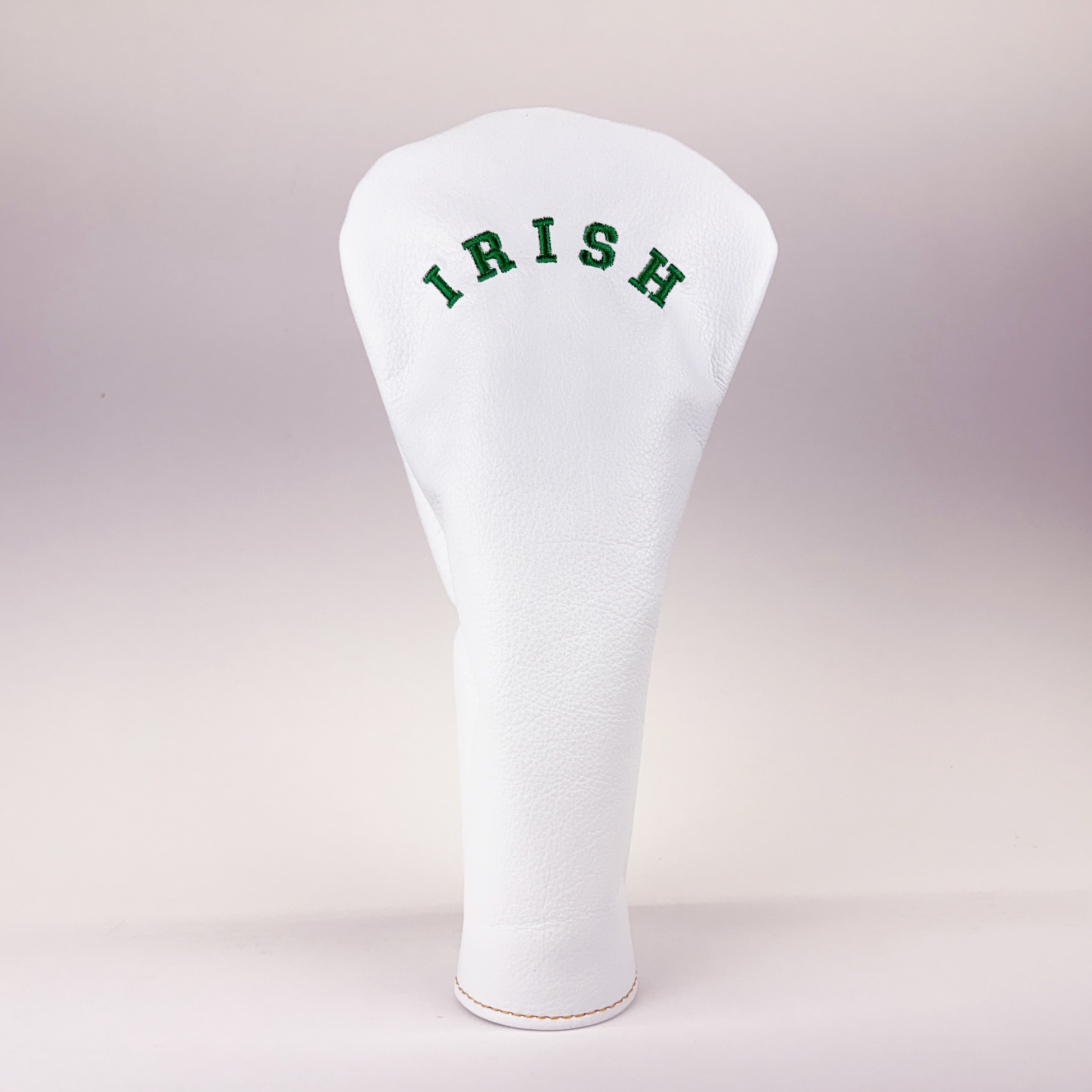 White golf club head cover with 'IRISH' text on a light gray background
