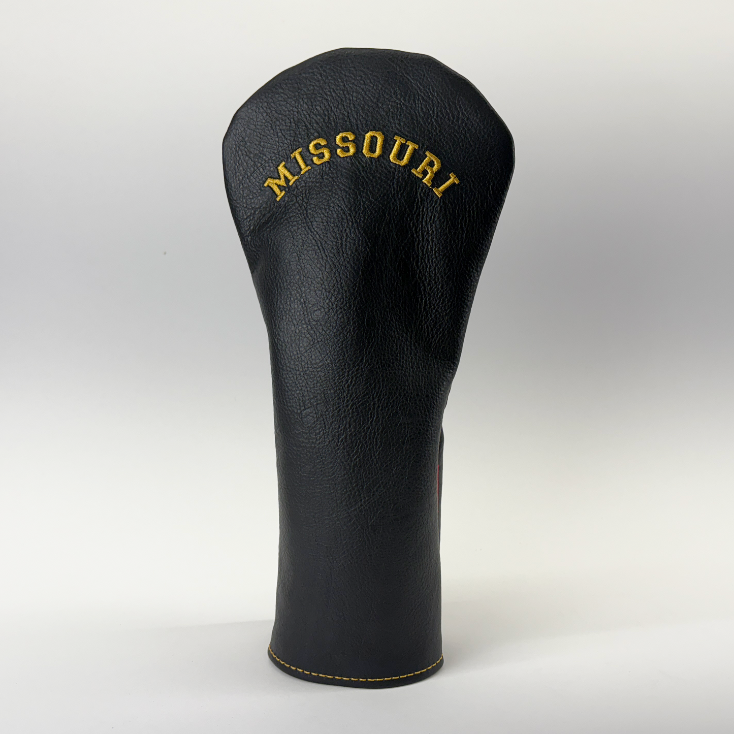 Black golf club head cover with 'Missouri' embroidery on a white background