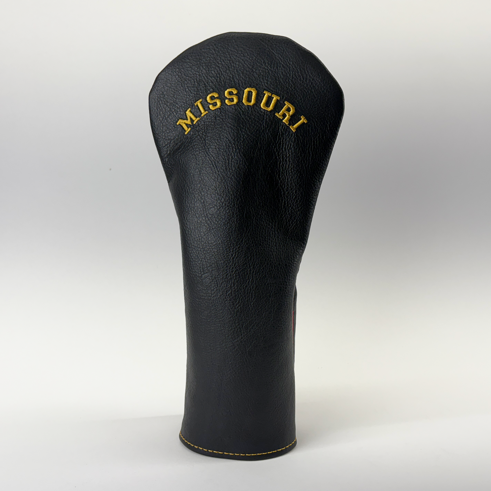 Black golf club head cover with 'Missouri' embroidery on a white background