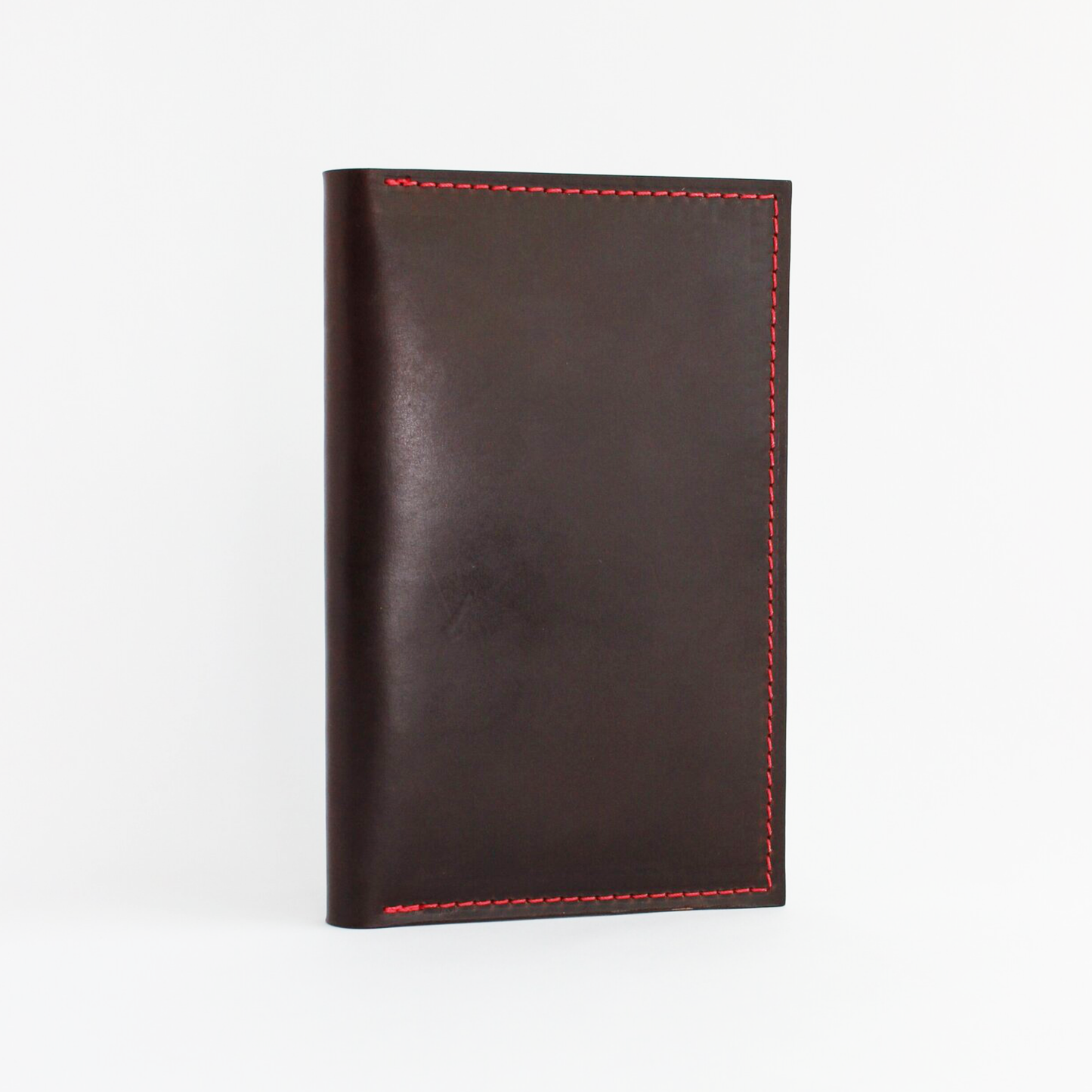 Brown leather wallet with red stitching on a white background