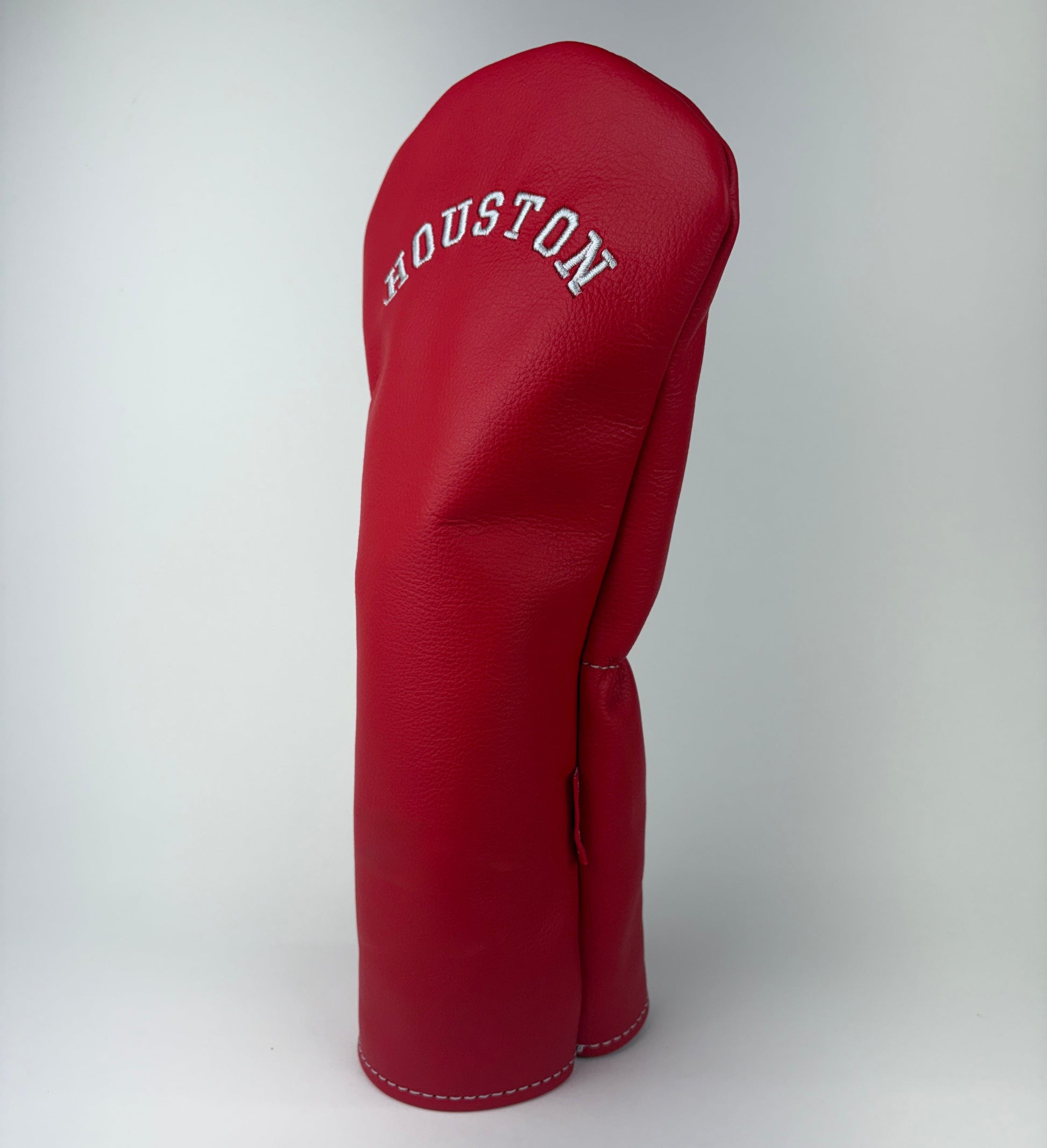 Red golf club head cover with 'Houston' branding on a white background