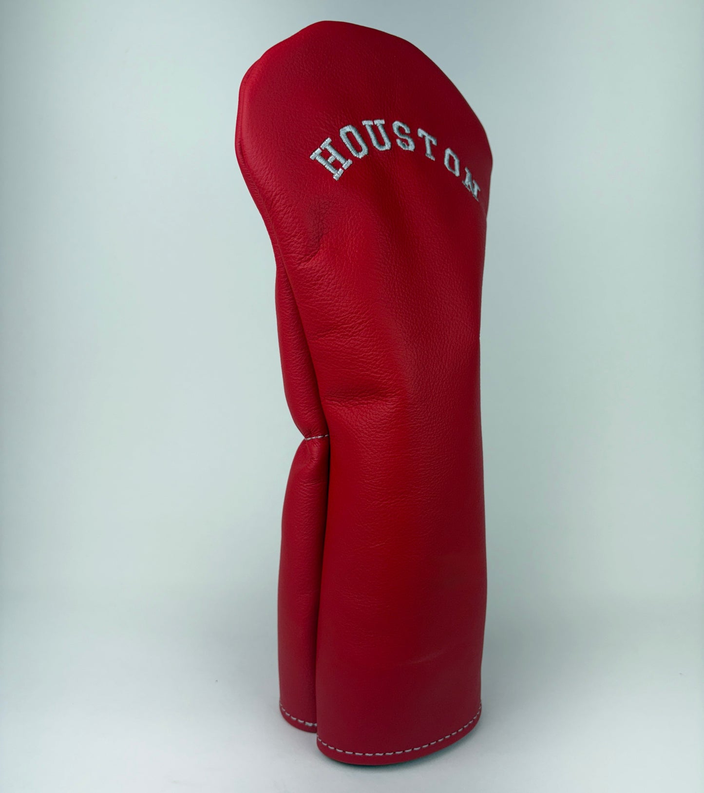 Red golf club head cover with 'Houston' branding on a white background