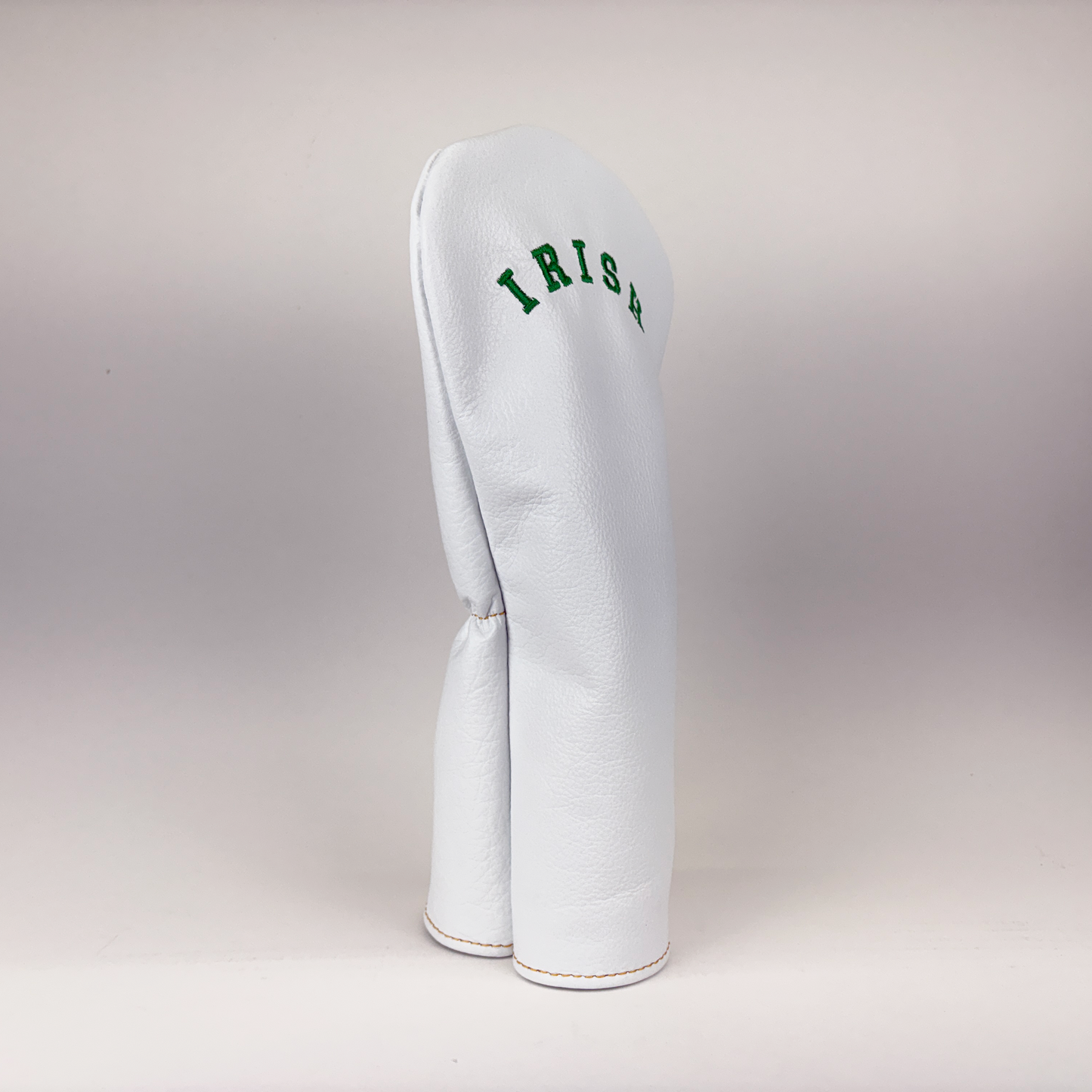 White golf club head cover with 'IRISH' text on a light gray background