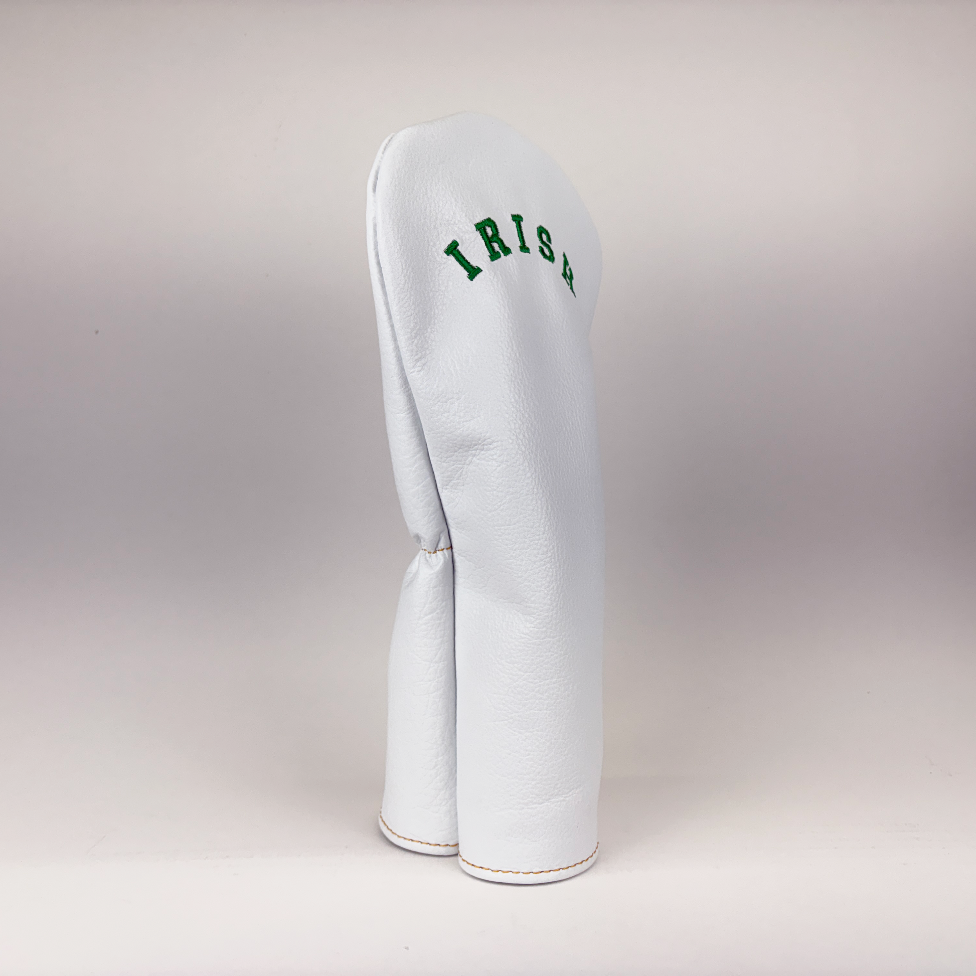 White golf club head cover with 'IRISH' text on a light gray background