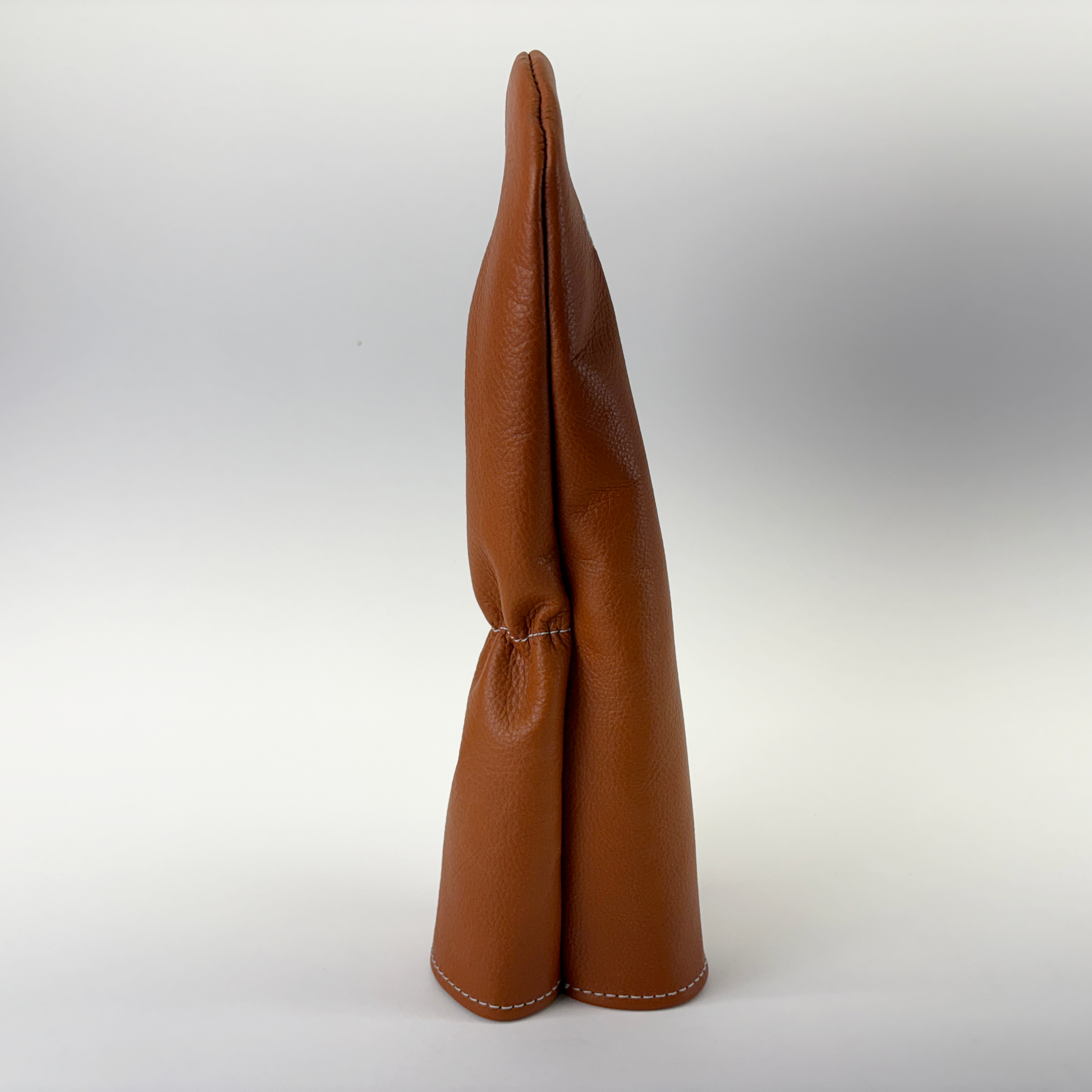 Brown leather golf cover on a white background