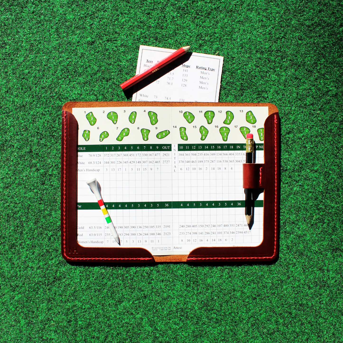 Golf scorecard holder with a green background