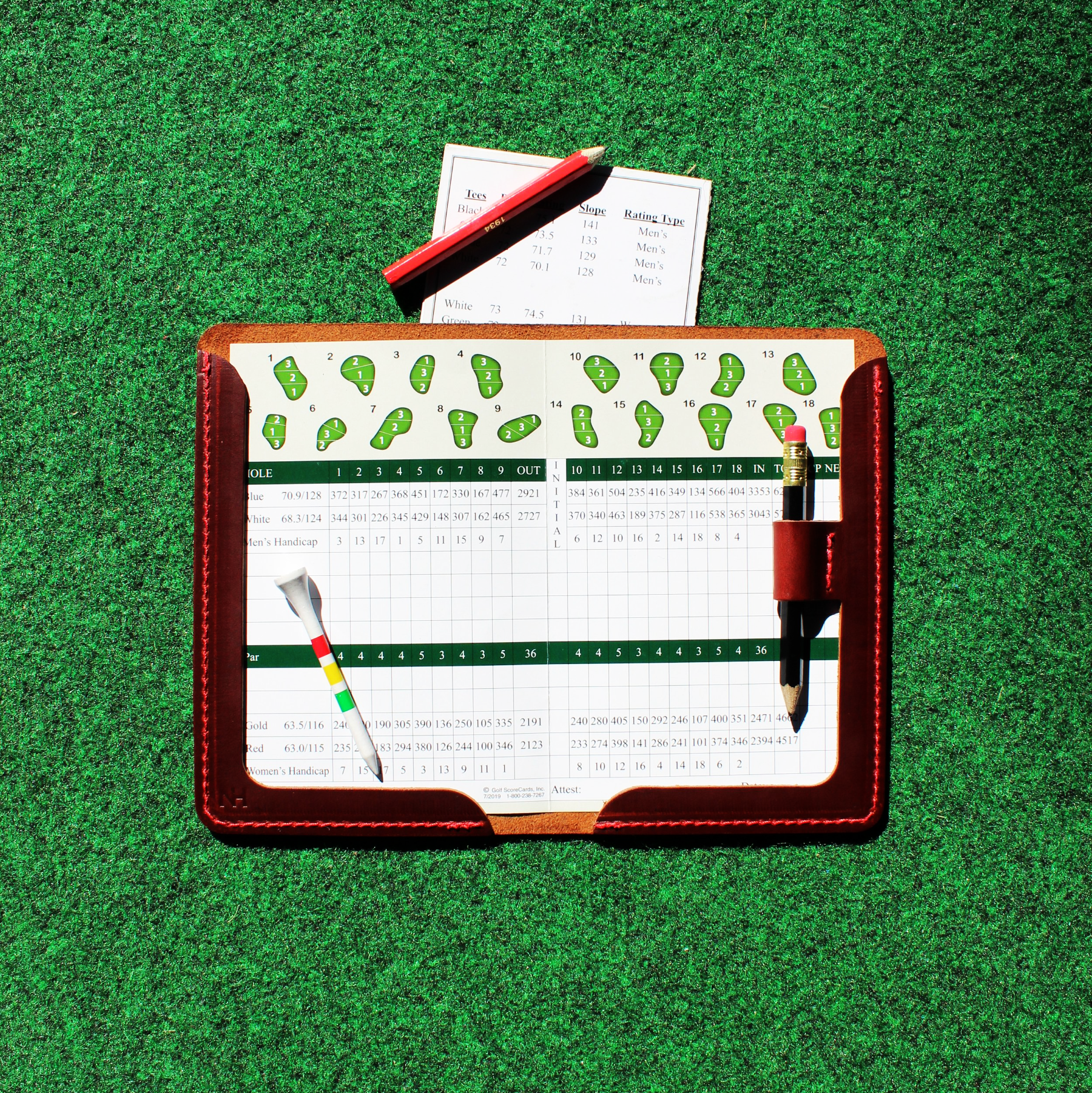 Golf scorecard holder with a green background