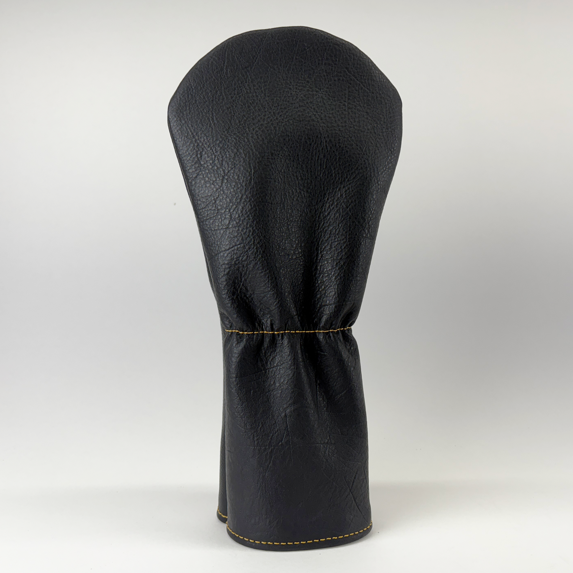 Black golf club head cover on a white background