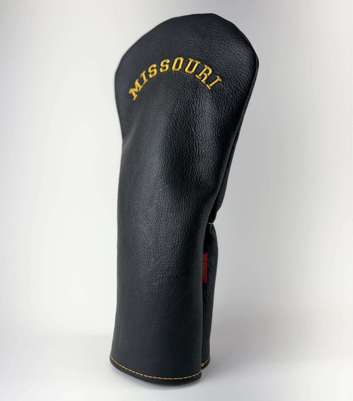Black golf club head cover with 'Missouri' embroidery on a white background